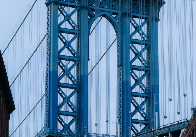 Steel suspension bridge tower with cables
